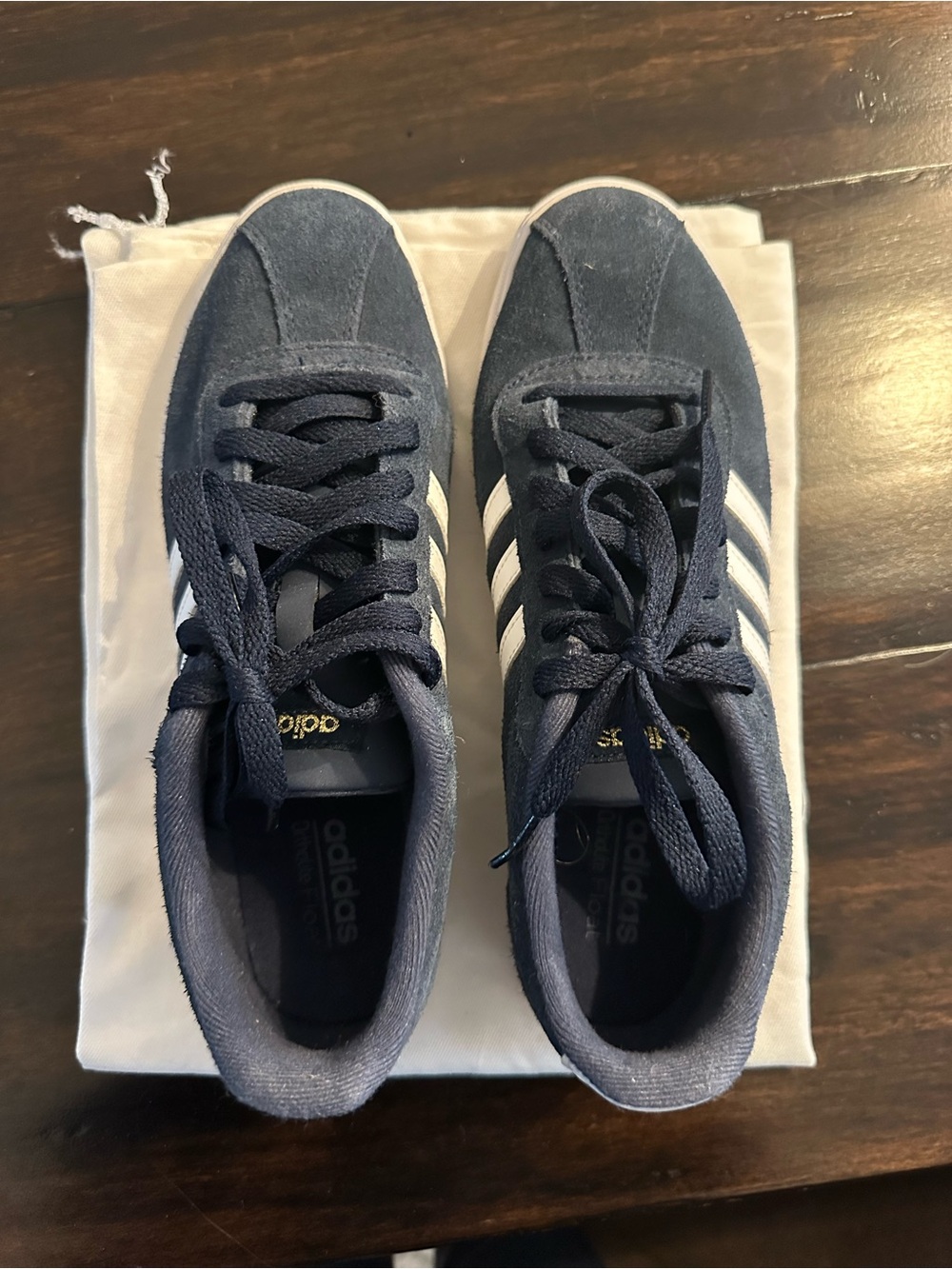adidas women’s Navy Suede Sneakers with White Stripes. Size 9.